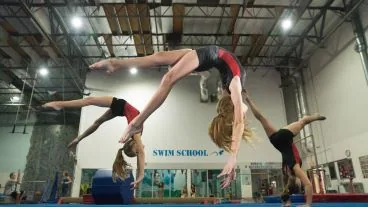 A Cal Elite gymnast mid back-handspring during Advanced Tumbling