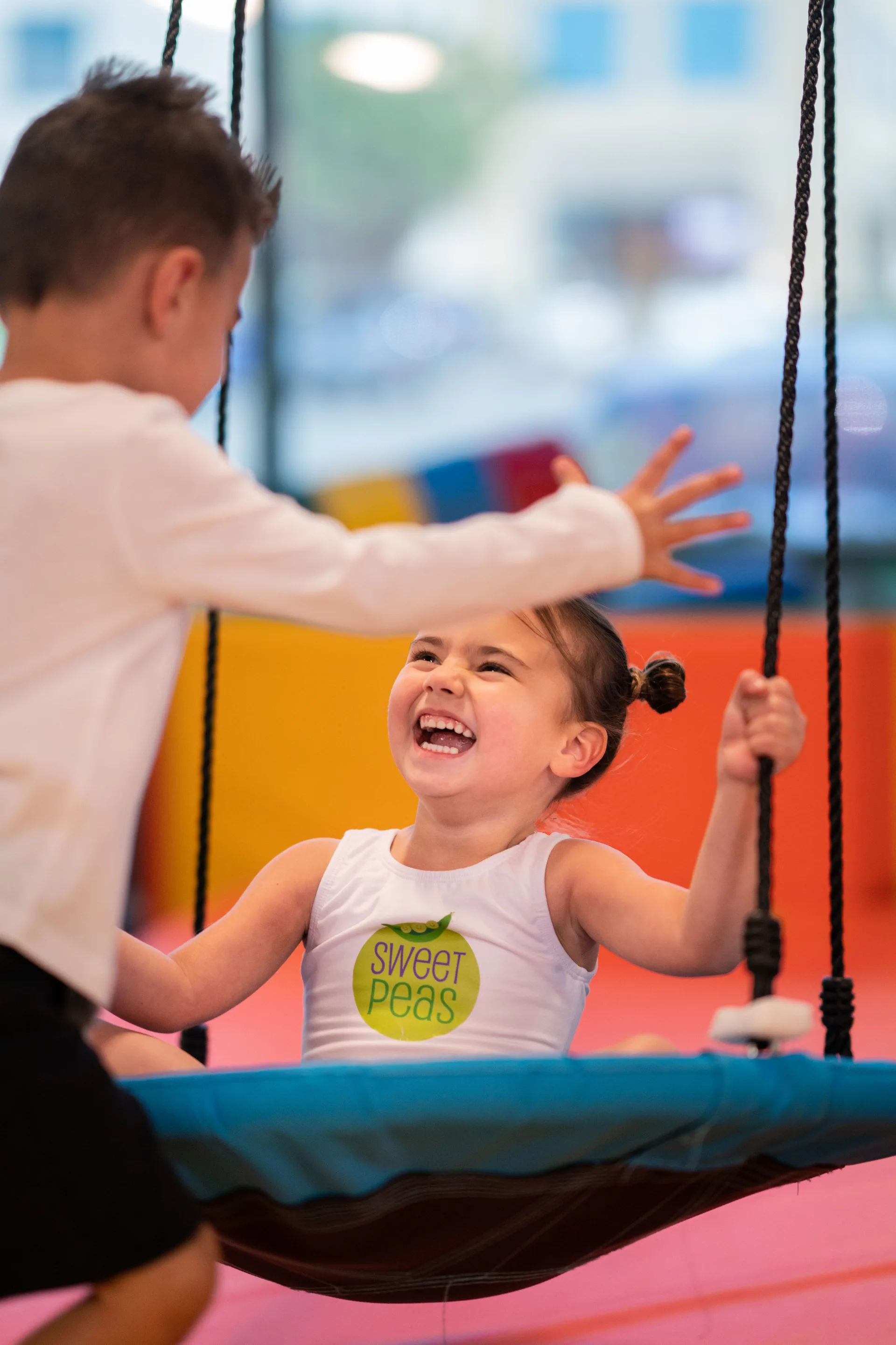 A young gymnast enjoying an aerial hammock at Cal Elite