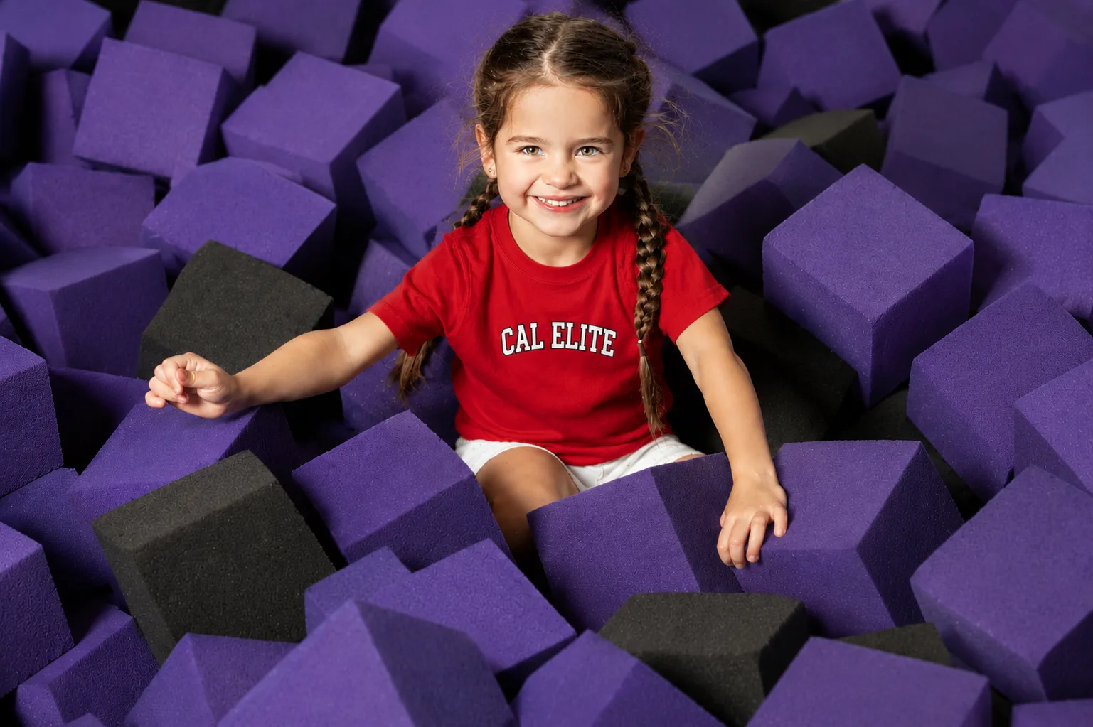 A Cal Elite gymnast practicing in the gym