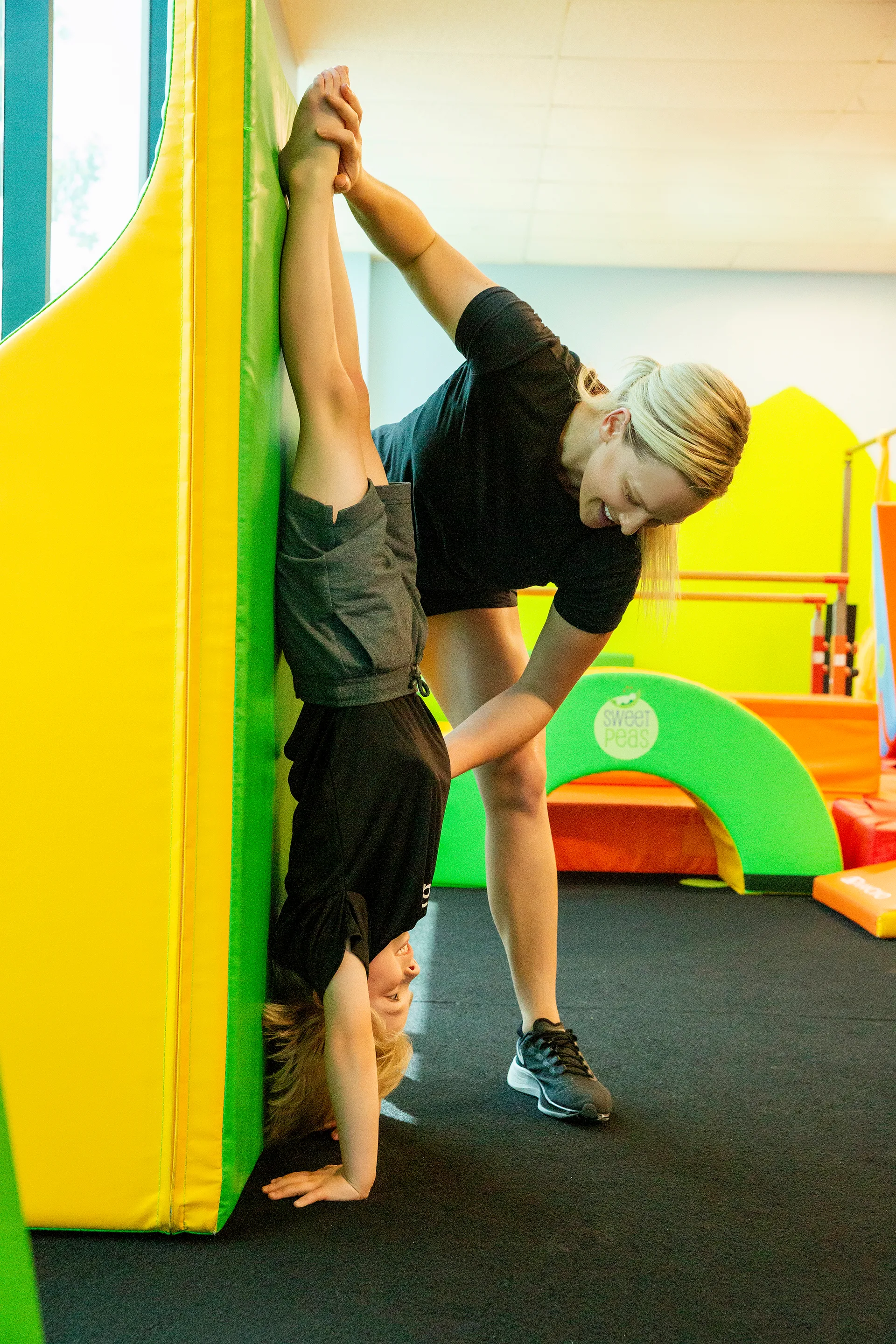 A young gymnast learning new skills at Cal Elite